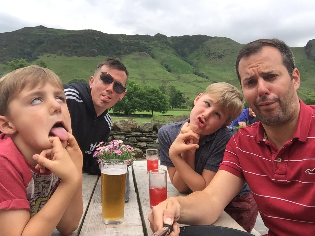 shared parental leave at REED - Peter Parking-Child with husband and boys pulling faces